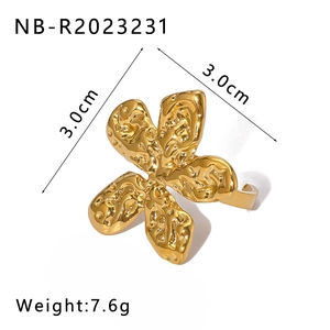 Detail view of gold flower ring with hammered texture and 3.0cm size dimensions