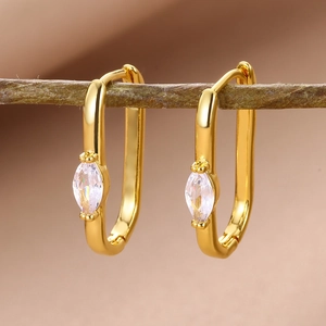 Macro shot of 18k gold plated U-shaped earrings with marquise-cut zircon stones