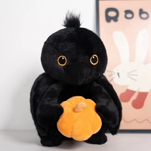 Cartoon black crow plush toy holding orange pumpkin for Halloween gift decoration
