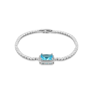 Macro view of silver-plated tennis bracelet with rectangular blue zircon and micro-pave crystals