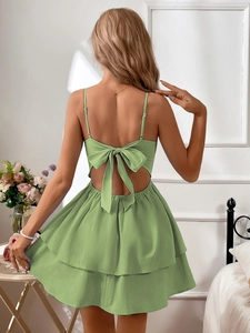 Detail of light green summer dress showing the large back bow and layered skirt