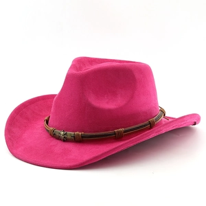 Detail of rose red suede cowboy hat with vintage metal ornament and curved brim