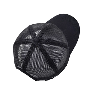 Detail view of the breathable black mesh back and smooth brim on this classic trucker cap