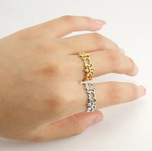 Detail view of 18K gold and silver plated hollow chain link rings worn on fingers