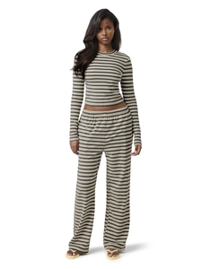 Detail view of the striped knit texture on high-waisted wide-leg loungewear trousers