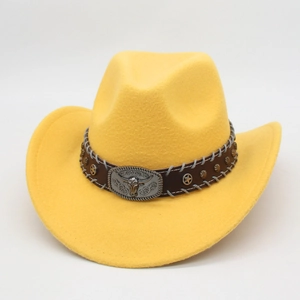 Detail of yellow cowboy hat featuring a brown band with star studs and a bull head buckle