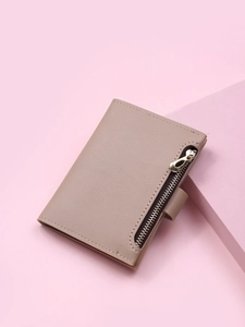 Detailed view of khaki leather card wallet with side zipper and metal snap closure