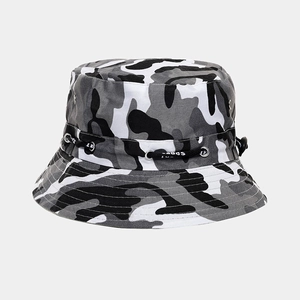 Detail of camouflage bucket hat with metal eyelets and adjustable black drawstring