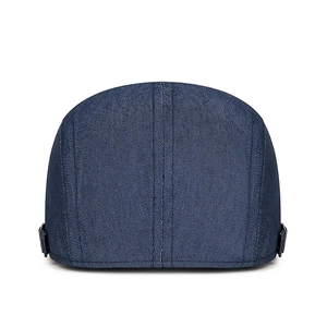 Adjustable dark blue denim newsboy cap with metal side buckles and twill texture