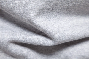 Macro detail of grey knit fabric texture showing premium soft weave and fiber quality