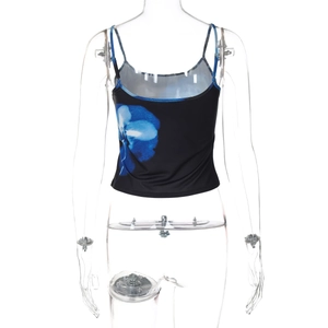 Close-up of black crop top featuring a blue abstract floral print and ribbed texture