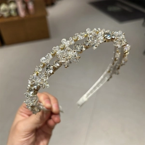 Detail of handcrafted crystal headband with sparkling rhinestones on golden frame