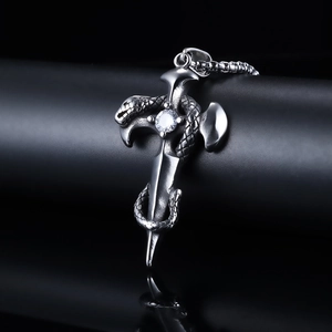 Gothic stainless steel snake-wrapped cross pendant with a brilliant white zircon