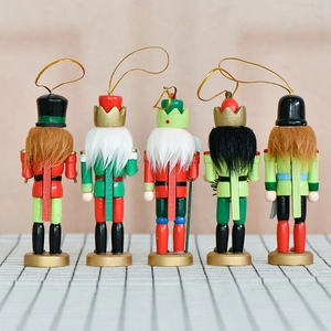 Set of five 13cm wooden Christmas nutcracker ornaments with colorful hand-painted details