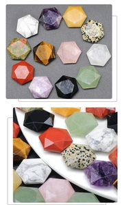 Detailed close-up of colorful faceted crystal star stones like amethyst and tiger eye