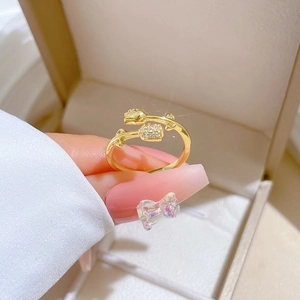 Close-up of gold tulip flower ring with clear crystals in a jewelry box