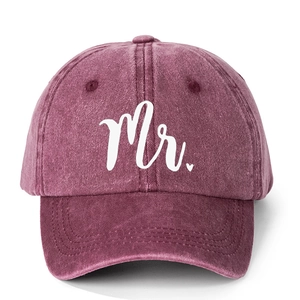 Close-up of vintage washed wine red baseball cap with white Mr. heart embroidery