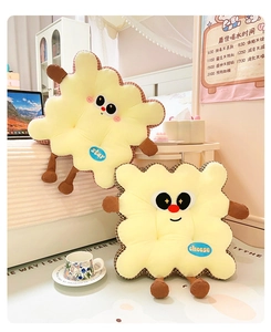 Detail of creative cartoon biscuit cushions with cute plush texture and embroidery