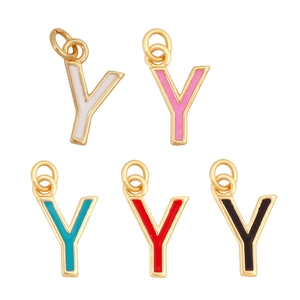 Macro detail of enamel letter Y pendants in white, pink, teal, red and black with gold plating