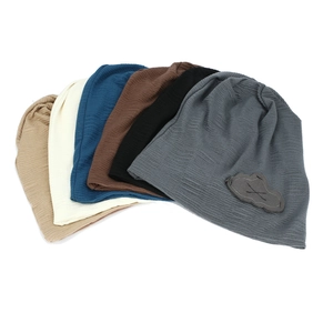 Slouchy knitted beanie hat in multiple colors with stylish cloud patch for women