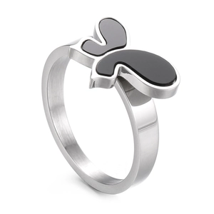Minimalist silver butterfly ring with black enamel accent in a stylish 45-degree view