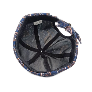 Internal detail of navy paisley miki hat featuring 100% cotton lining and adjustable strap