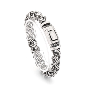 Vintage silver woven chain bracelet for men in stainless steel on acrylic stand