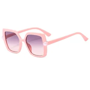 Pink square kids sunglasses with gradient purple lenses and pearl accents on the frame