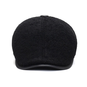 Winter men's black flat cap with warm faux shearling and stylish leather brim detail