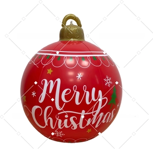Detail of red inflatable Christmas ball with gold hook, Merry Christmas text and snowflakes