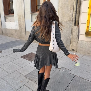 Detailed back view of a striped off-shoulder top and asymmetrical mini skirt set