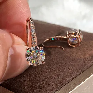 Elegant rose gold drop earrings with round zircon stones and pavé set hook hooks