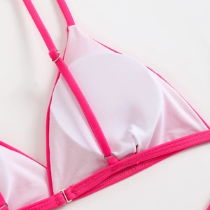 Detail of neon pink bikini top with mesh lining and removable pads for beach swimwear