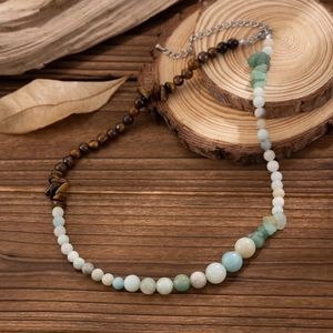 Men's bohemian beaded necklace with tiger eye and turquoise stones on wooden background