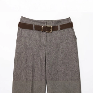 Women's dark grey herringbone trousers with brown leather belt and golden metal buckle