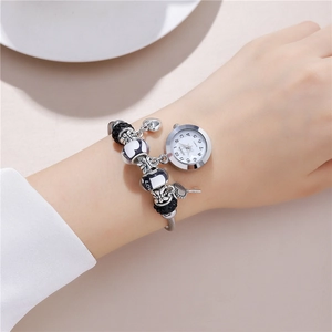 Elegant silver beaded bracelet watch for women with heart and key charms on wrist