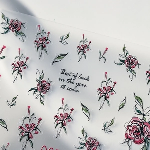 Stickers nail art floraux avec lys rouges et roses roses sur support translucide