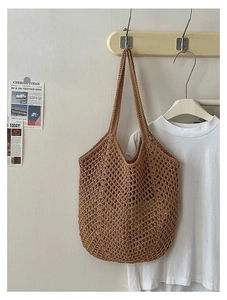 Close-up of brown cotton woven beach tote bag featuring detailed hollow mesh pattern