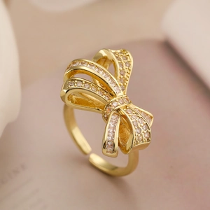 Elegant gold plated bow ring with sparkling cubic zirconia crystals for women