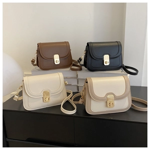 Detail of elegant shoulder bags with golden twist lock and adjustable straps in four colors