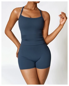 Close-up of the deep blue brushed fabric and precise stitching on the yoga tank top