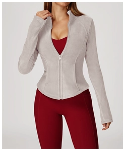 Detailed close-up of a warm oatmeal fleece jacket with stand collar and zipper