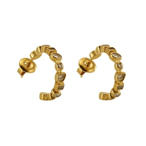 Pair of gold U-shaped earrings with geometric cubic zirconia on polished metal