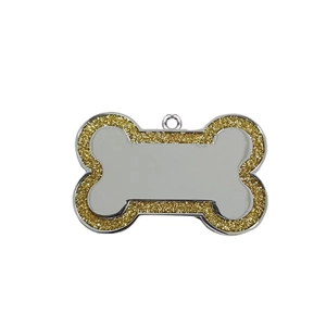 Detailed close-up of bone-shaped zinc alloy pet ID tag with gold glitter and silver finish