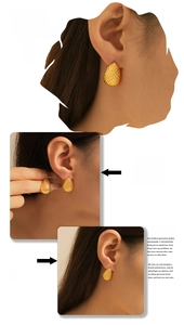 Detail of teardrop mesh texture earrings in 18k gold plating worn by a model