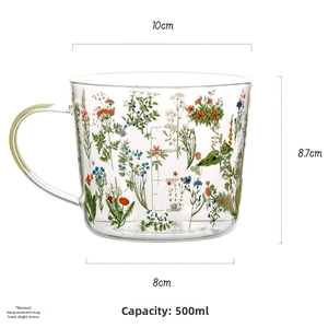 Close-up of 500ml floral glass mug showing capacity scale and large diameter rim