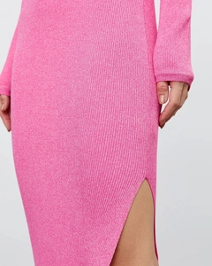 Close-up of ribbed knit texture on a rose pink dress with high side slit detail
