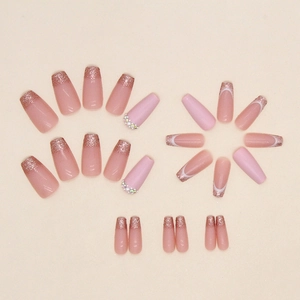 Long ballet press-on nails with pink glitter gradient and rhinestone accents