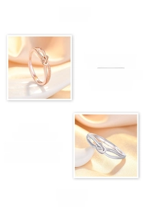 Detail of S925 sterling silver infinity knot ring with high-polish mirror finish surface