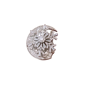 Elegant silver crescent moon and snowflake brooch with shimmering cubic zirconia stones